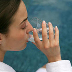 attractive woman drinking a glass of water 